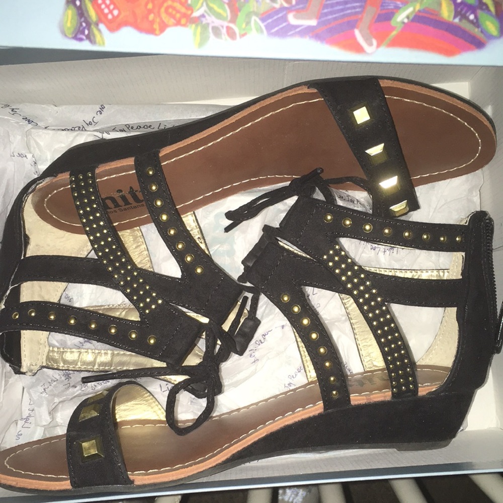 Unity by Carlos Santana. Size 7.5 Black with gold Hardware